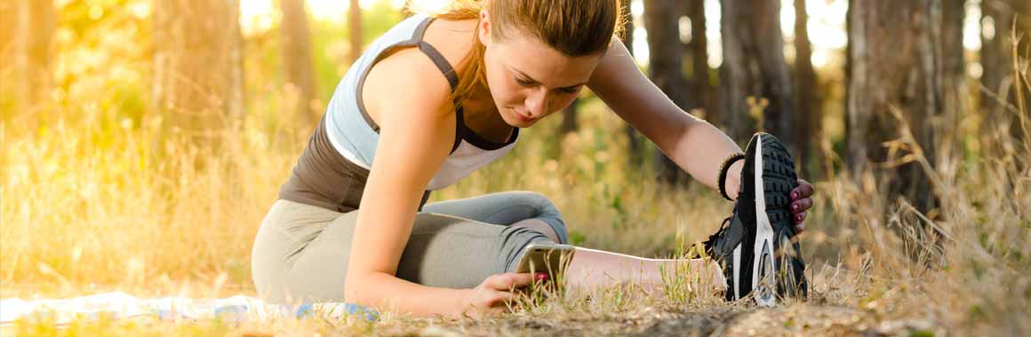 woman exercising with phone