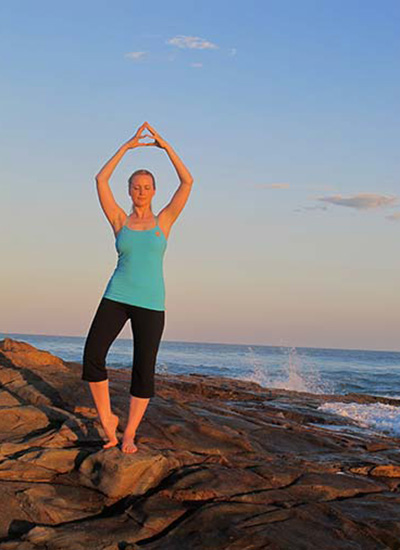 Dru Yoga - practicing energisation mudra on the beach